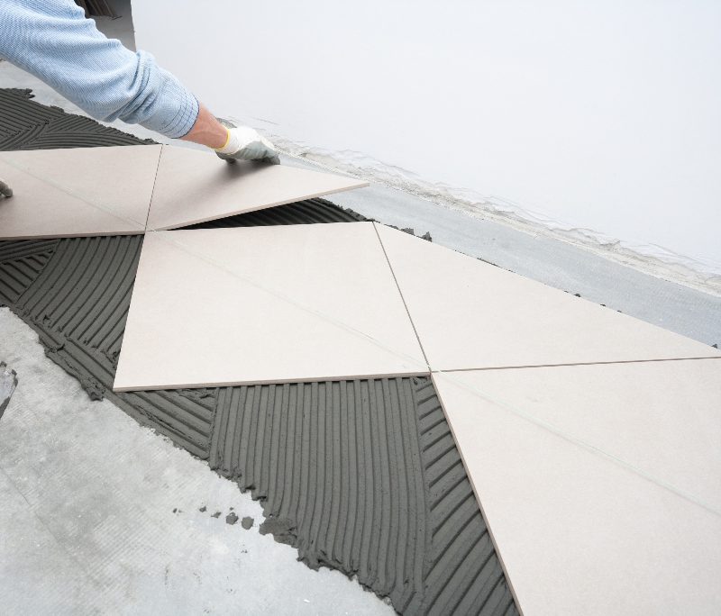 A tile floor being installed during a repair job
