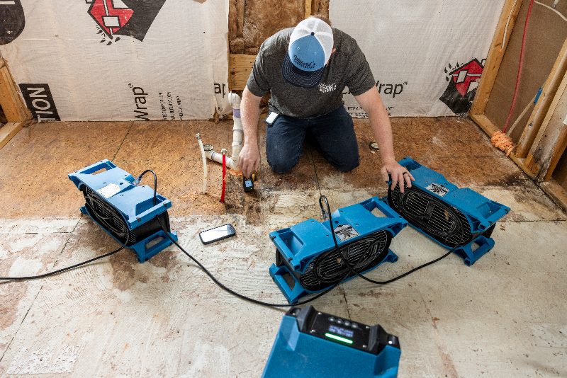 Air movers and a moisture reading during water extraction and drying
