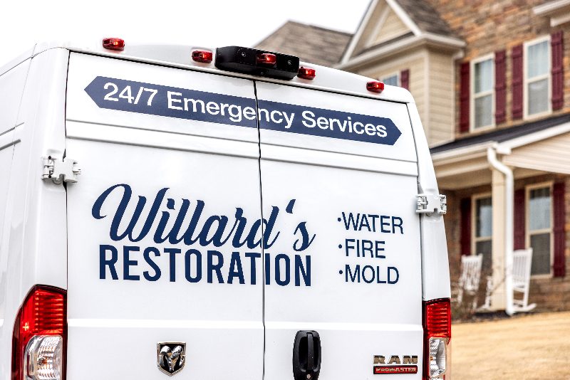 The back of a Willard's Restoration service van on a job